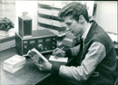 Young Man Reading a CB Book - Vintage Photograph