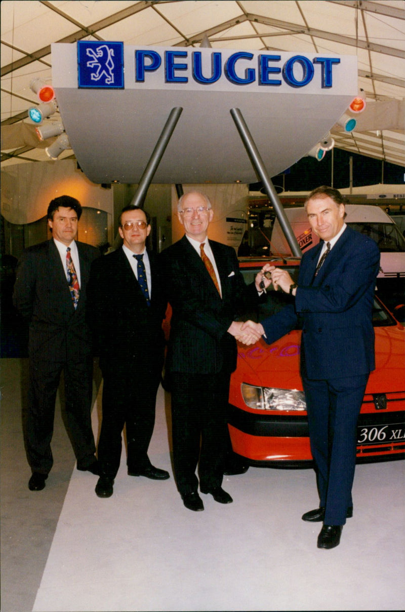Peugeot Managing Director Geoffrey Whalen presents the first car from a £1.5 million order to Jeff Prince of the Post Office. - Vintage Photograph