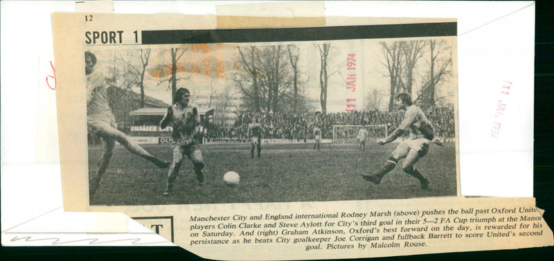 Manchester City and England international Rodney Marsh pushes the ball past Oxford players for City's third goal in their FA Cup triumph. - Vintage Photograph