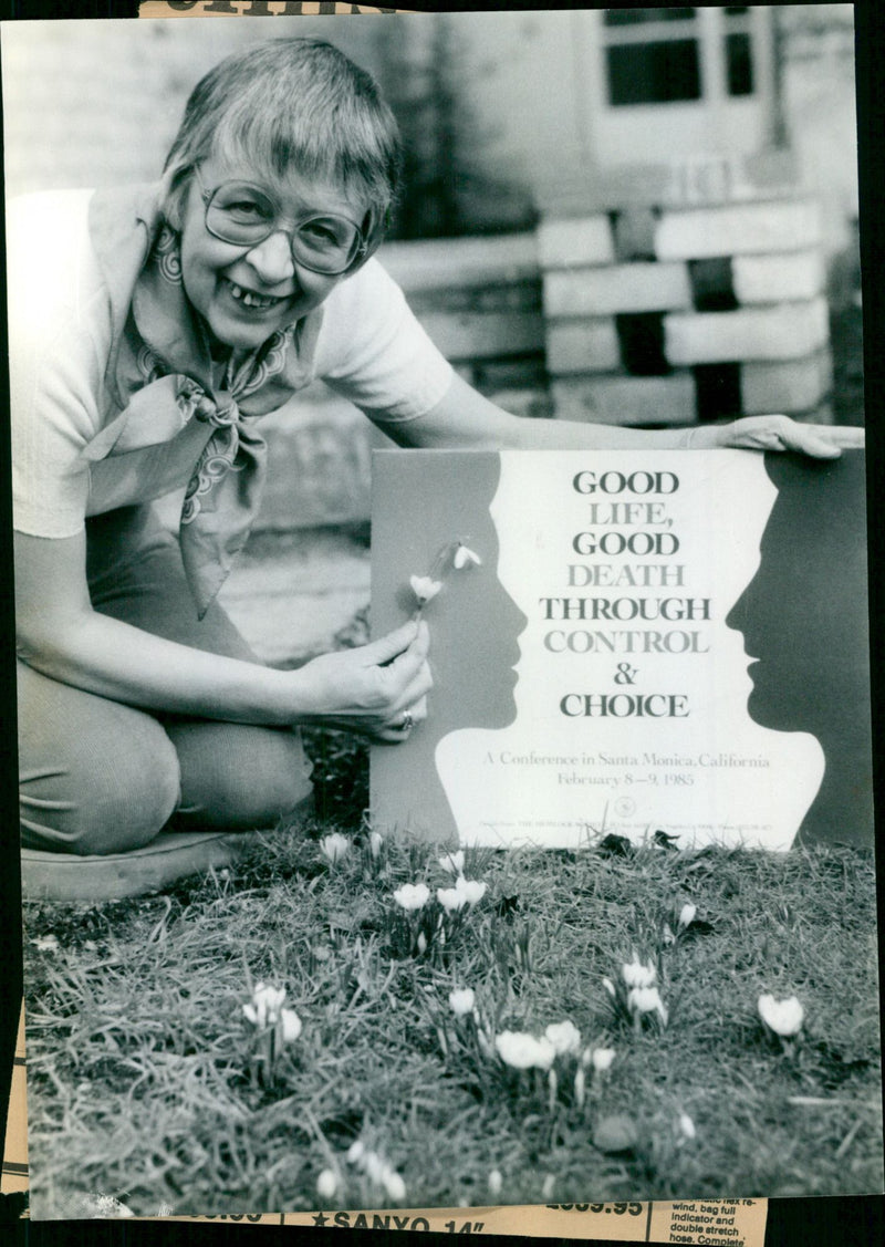Jean Davies with a poster from the American conference she addressed/ - Vintage Photograph