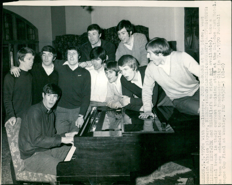 West Bromwich Albion players take a musical break in their training stint at the Selsdon Park Hotel. - Vintage Photograph