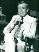 Actor Val Doonican in a scene from the BBC program "The Val Doonican Music Show" in 1984. - Vintage Photograph