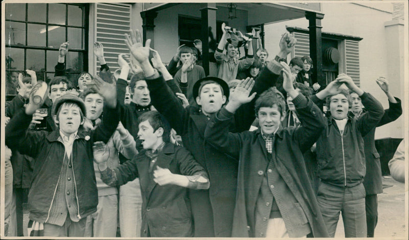 Watford supporters celebrate their team's victory in a public house opposite the Oxford v. Watford Cup-tie. - Vintage Photograph