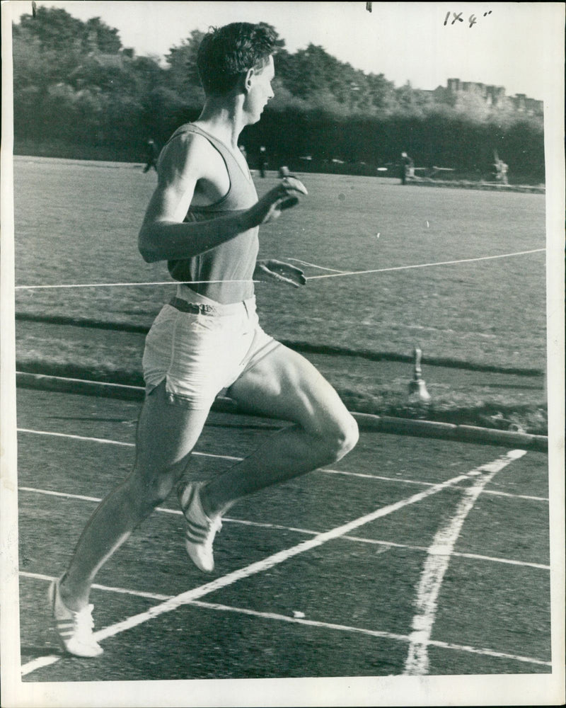 Mike Hogan of the Oxford University Athletic Club wins the senior 220 yards race. - Vintage Photograph