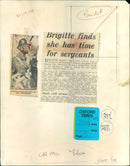 Brigitte Bardot poses with airmen from Abingdon RAF Station during a break from filming her latest movie. - Vintage Photograph