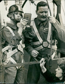 Brigitte Bardot poses with airmen from Abingdon RAF Station during a break from filming her latest movie. - Vintage Photograph