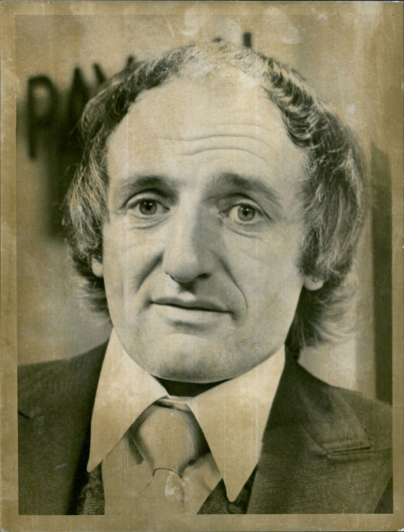 Actor Jeremy Young portrays bookmaker Benny Lewis on the set of Coronation Street. - Vintage Photograph