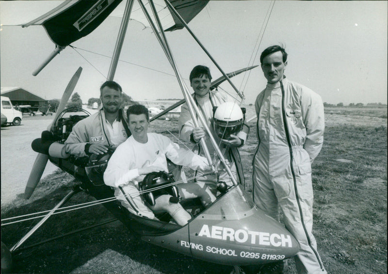 Four men prepare for a record-breaking microlight flight around the British coast. - Vintage Photograph