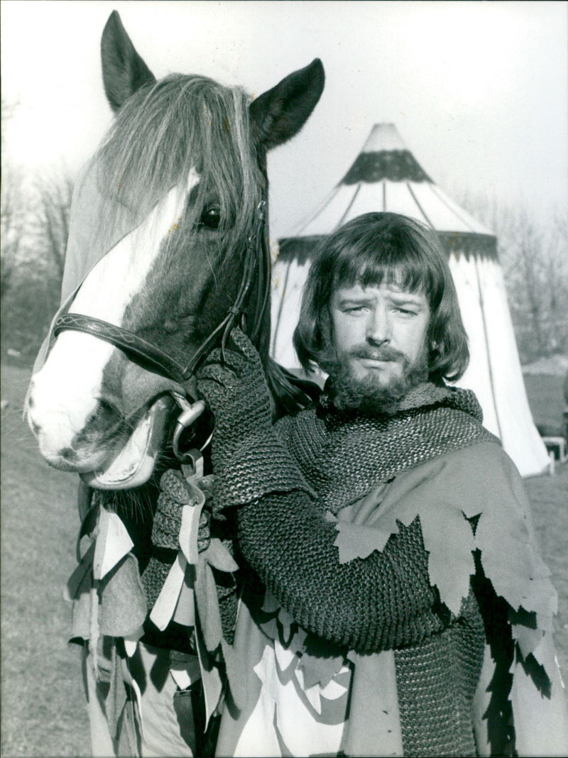 Les Dennis mounts a rescue of a damsel in distress in the Les Dennis Laughter Show on BBC. - Vintage Photograph