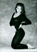 Actress Diane Youdale poses while filming a dance aerobics video with IMC Video Limited Productions. - Vintage Photograph