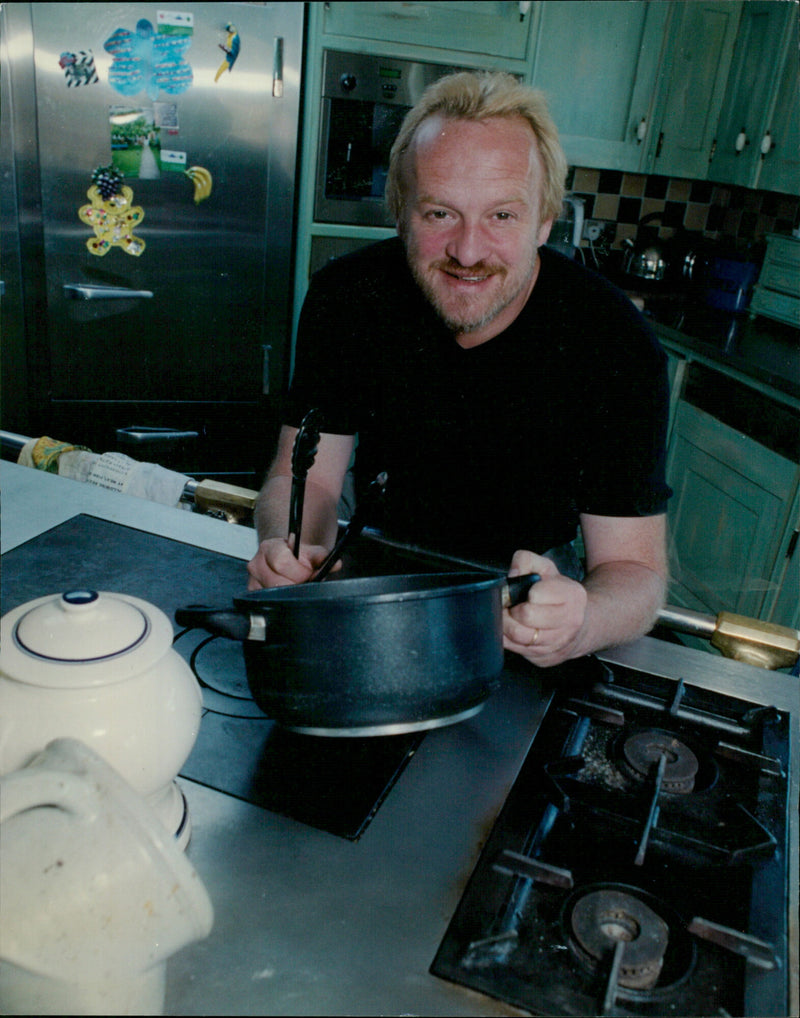 Celebrity chef Antony Worrall-Thompson in his organic garden. - Vintage Photograph