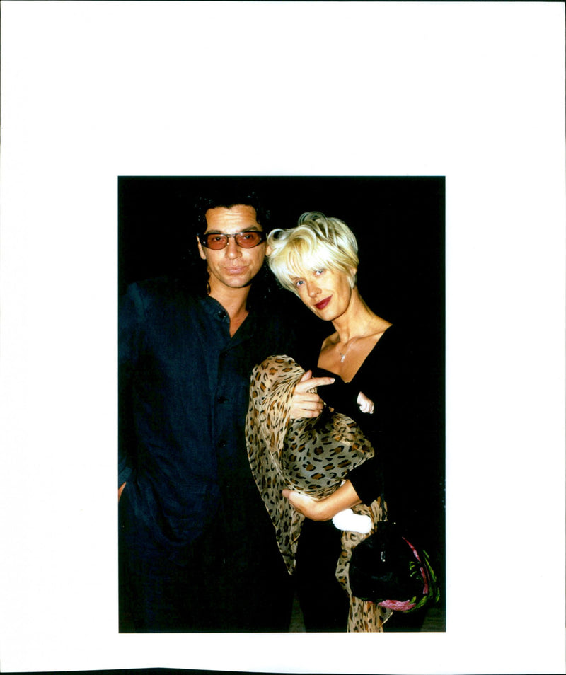 Michael Hutchence and Paula Yates pose for a picture with their daughter Heavenly Hiraani. - Vintage Photograph