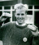 Ian Williamson with packets of tea - Vintage Photograph
