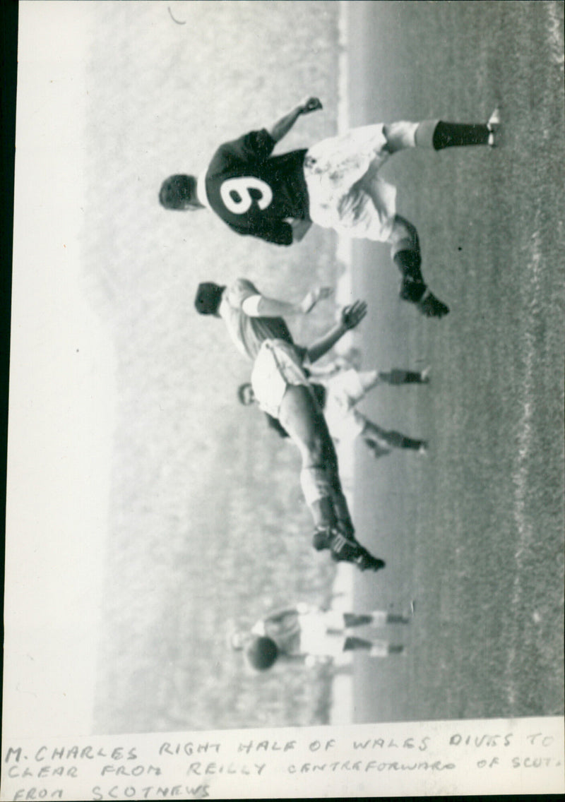 M Charles half of wales dives to clear from Reilly of scot - Vintage Photograph