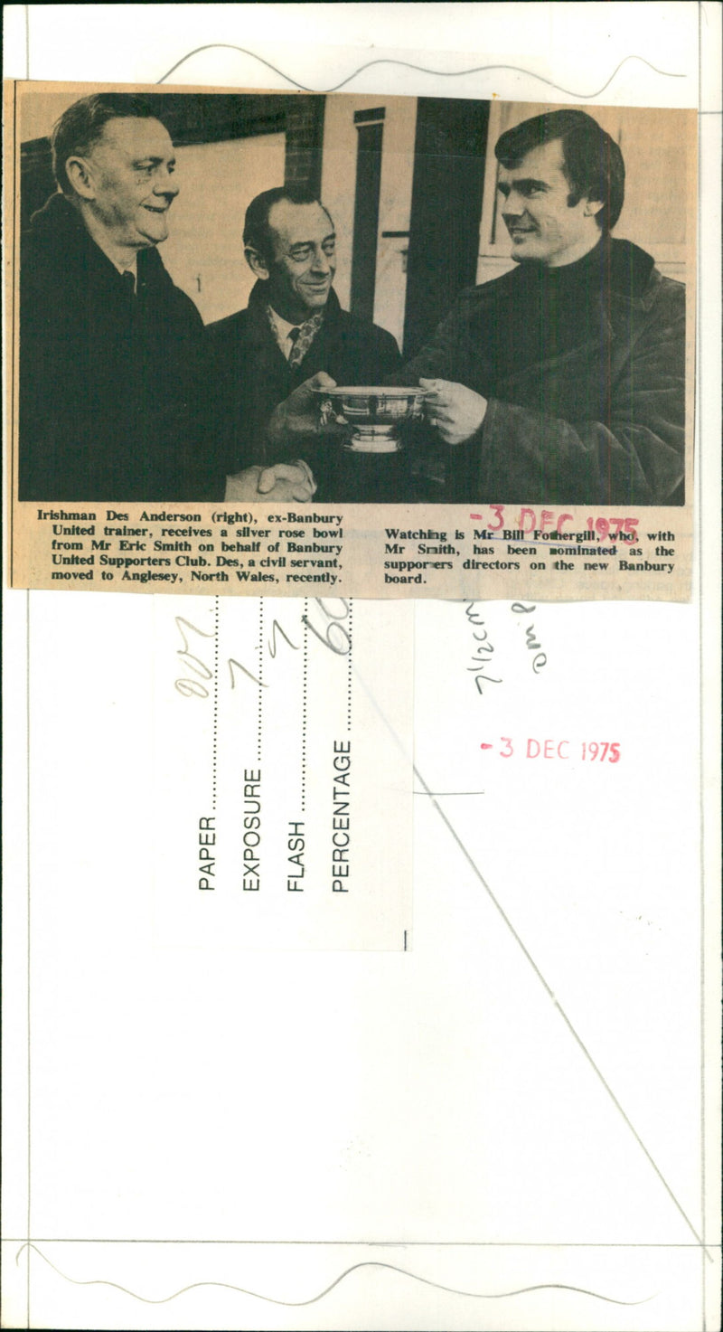 Des Anderson (right) receives a silver rose bowl from mr Eric Smith - Vintage Photograph