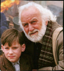 Nick Robinson and Annabelle Apsion celebrate Villie's tenth birthday in a scene from the movie "Villie". - Vintage Photograph