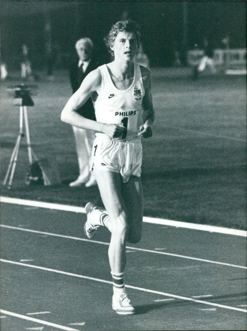 Athlete Steve Cram celebrates his victory in the Bannister Mile. - Vintage Photograph