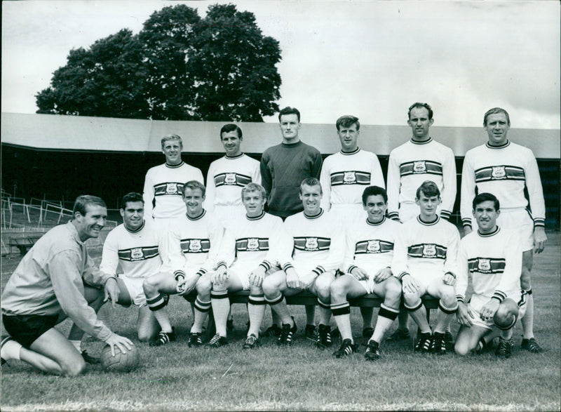 Plymouth Argyle Football team and their new manager, Malcolm Allison, pose for a team photo. - Vintage Photograph