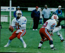 American football players Wayne Mayers, Troy Lee Smith, and Henry Johnson at the 2000 Domins T SP game. - Vintage Photograph