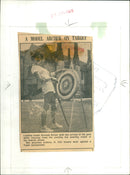 Model Shelagh Driver takes aim during a break from the fashion shows. - Vintage Photograph