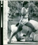 Zola Budd of Britain passes Mary Decker of the United States during the women's 3,000-meter race at the 1984 Olympic Games in Los Angeles. - Vintage Photograph
