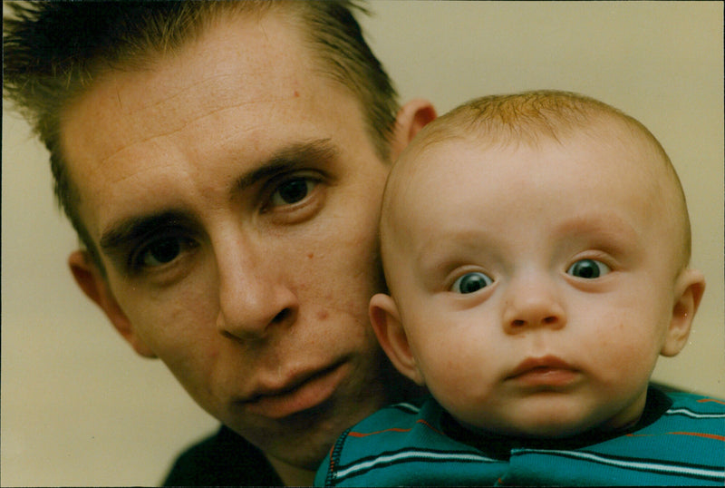 Barry Fiddes and his son Dylan pose for a photo. - Vintage Photograph