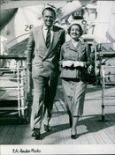 Douglas Fairbanks J. and his wife enjoying a meal and a film. - Vintage Photograph