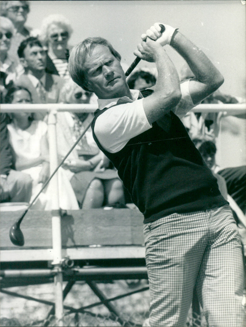 Jack Nicklaus swings his golf club at The Masters golf tournament in Augusta, Georgia. - Vintage Photograph