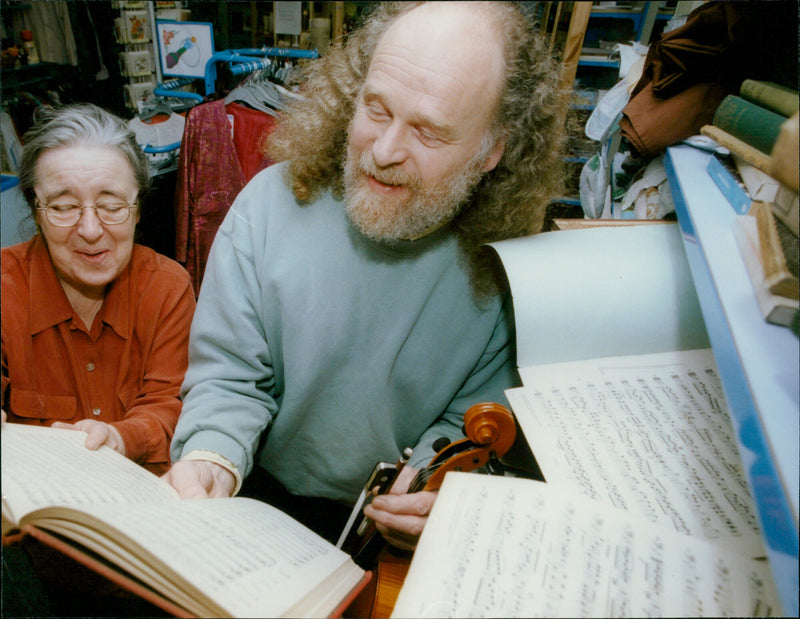 Mrs. Anne Collie and her husband, John, donate sheet music to Oxfam. - Vintage Photograph