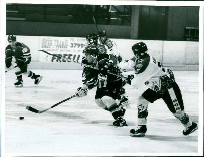 Derek Flint gets away as Stuart Coleman tries to pull him back with a stick - Vintage Photograph