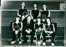 Abingdon ManuLife's badminton team show off their new tracksuits to ManuLife underwriter Peter Cattell. - Vintage Photograph