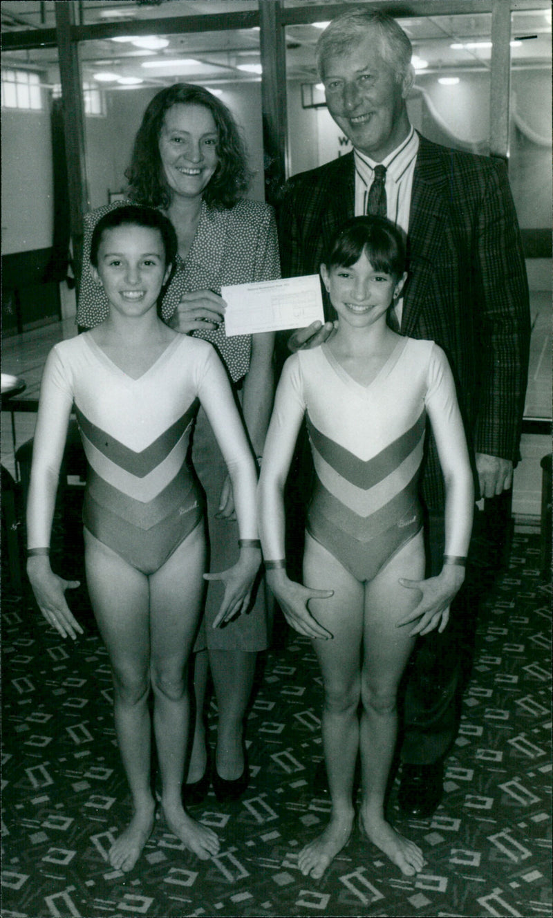Tony Ward, Chairman of the Recreation Committee, presents a cheque to the Thompson family. - Vintage Photograph