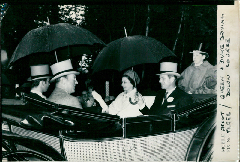 Queen Elizabeth II smiles as she drives up the course at Royal Ascot in 1981. - Vintage Photograph