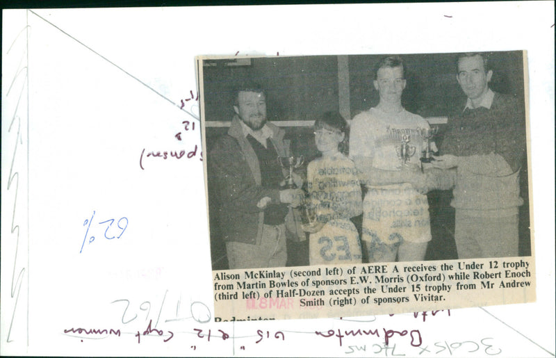 Alison McKinlay of AERE A receives the Under 12 trophy while Robert Enoch of Half-Dozen accepts the Under 15 trophy. - Vintage Photograph