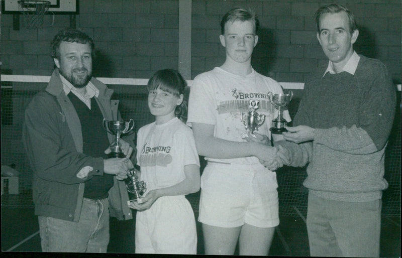 Alison McKinlay of AERE A receives the Under 12 trophy while Robert Enoch of Half-Dozen accepts the Under 15 trophy. - Vintage Photograph