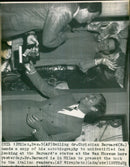 Christian Barnard hands a copy of his autobiography to unidentified fan looking at Barnards status - Vintage Photograph