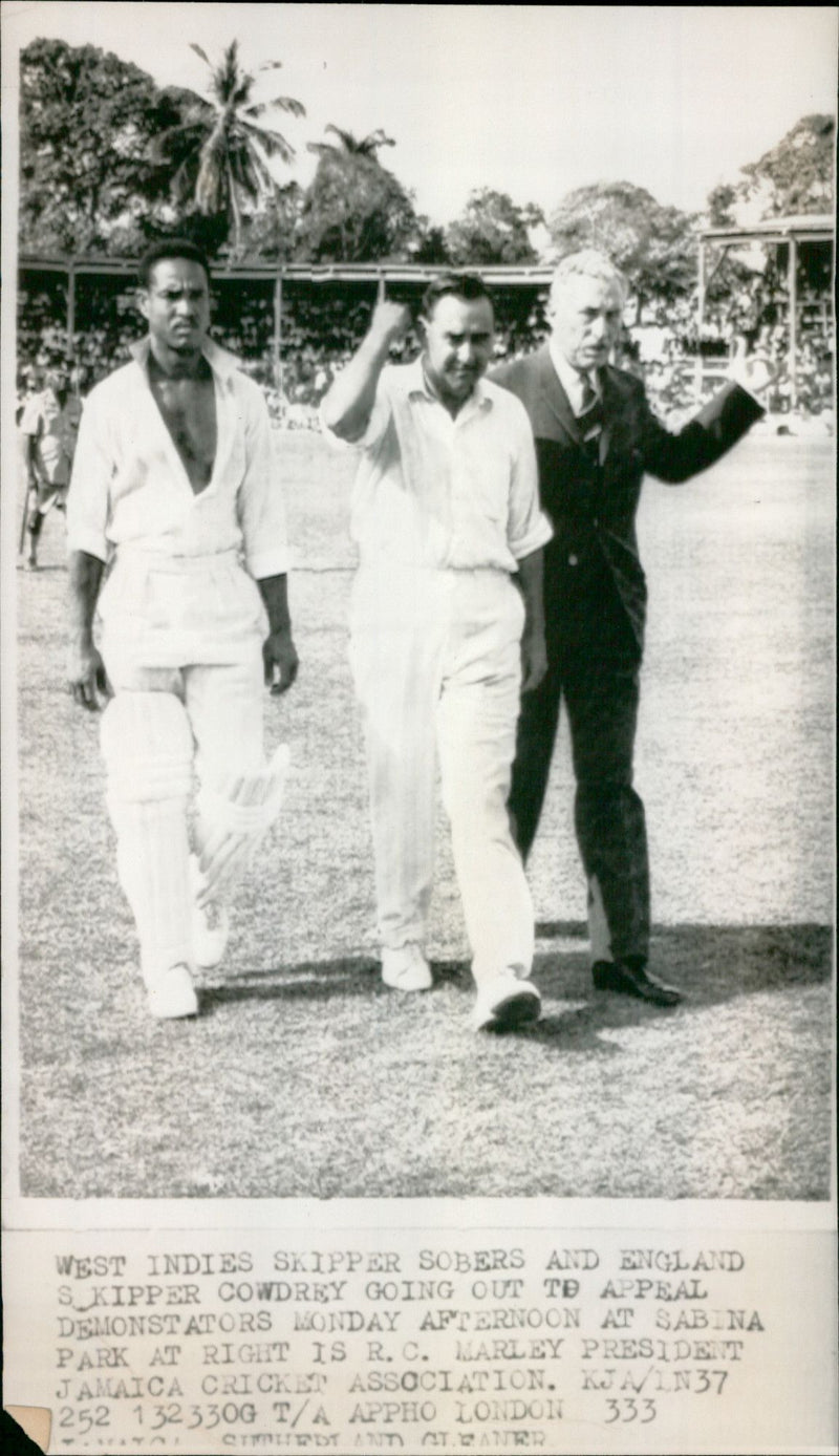 West Indies skipper Garry Sobers and England skipper Colin Cowdrey appeal to demonstrators at Sabina Park in Jamaica. - Vintage Photograph