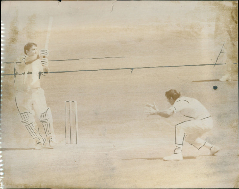 Colin Milburn hooks a ball for four off of Graham McKenzie during a morning innings. - Vintage Photograph