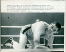 Wally Swift of Nottingham on canvas after being knocked down in third round by Leslie Mcateer of birknhead - Vintage Photograph