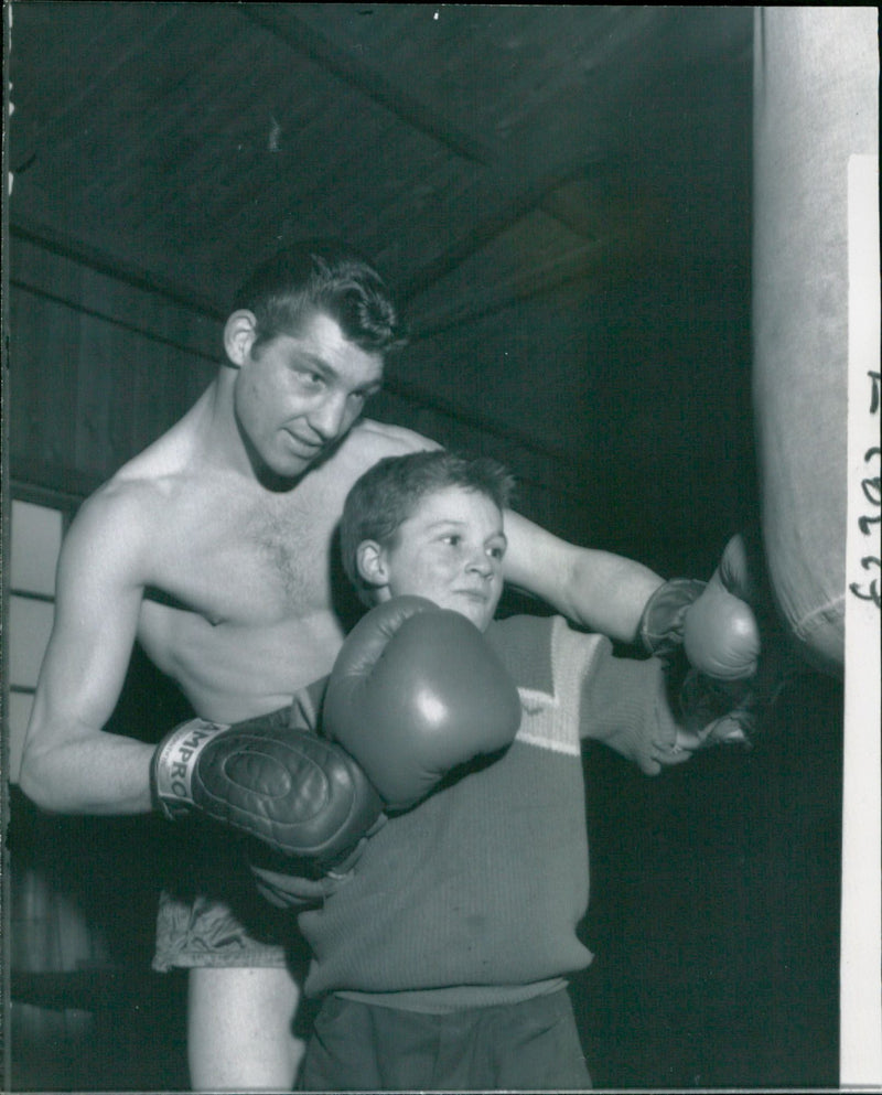Neil swift brother of Wally Swift  receiving tuition on the punching bag - Vintage Photograph