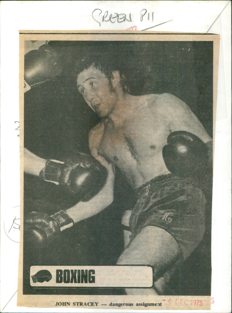 Boxer John Stracey (left) and Grezeni Pis (right) sparring in a boxing ring. - Vintage Photograph