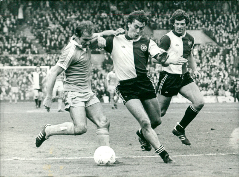 England internationals Ian Gillard, Dave Thomas and Dennis Tueart battle for the ball during a League match in Manchester, PA on November 15th, 1976. - Vintage Photograph