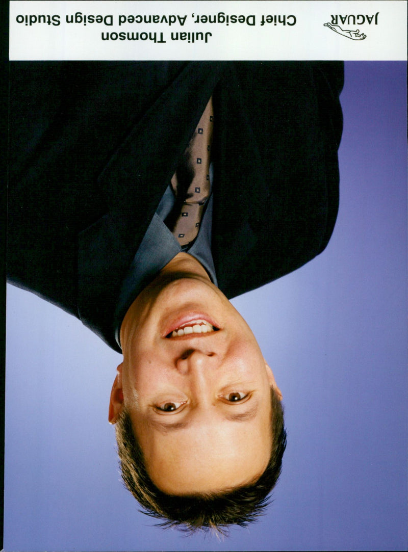 Jaguar Chief Designer Julian Thomson inspects a model car. - Vintage Photograph