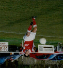 Peter Rhoades-Brown, a signwriter and football player, stands in front of a vending machine in Abingdon. - Vintage Photograph