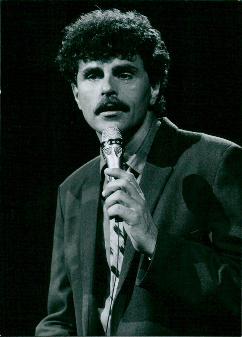 Robert De Long performing in a German show in the Netherlands. - Vintage Photograph