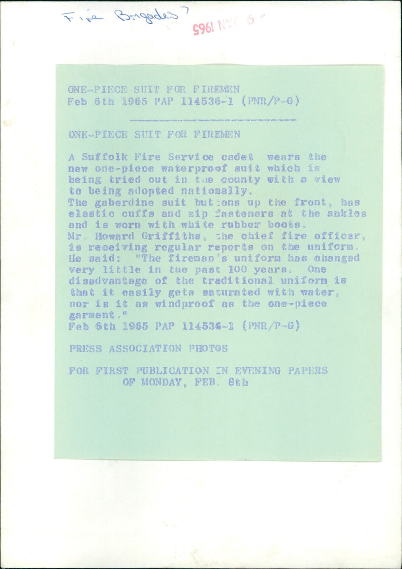 A Suffolk Fire Service cadet models the new one-piece waterproof suit being tested in the county. - Vintage Photograph