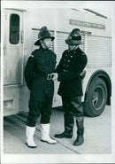 A Suffolk Fire Service cadet models the new one-piece waterproof suit being tested in the county. - Vintage Photograph