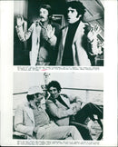 Ex-CIA agents Elliott Gould and Donald Sutherland trying to find a micro dot film in Paris. - Vintage Photograph