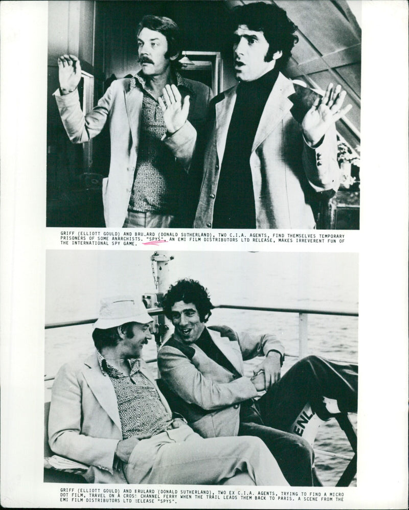 Ex-CIA agents Elliott Gould and Donald Sutherland trying to find a micro dot film in Paris. - Vintage Photograph