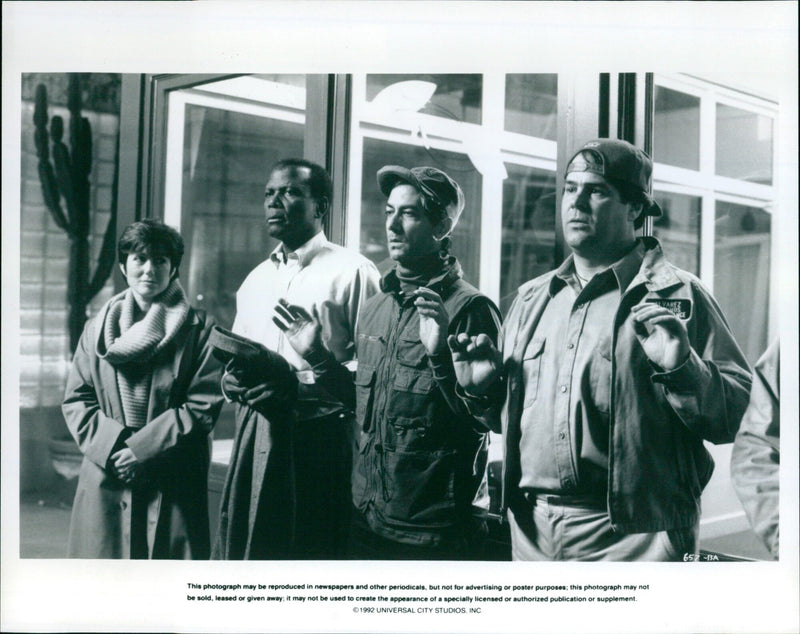 Mary McDonnell, Sidney Poitier, David Strathairn, and Dan Aykroyd in a scene from the film "Sneakers". - Vintage Photograph